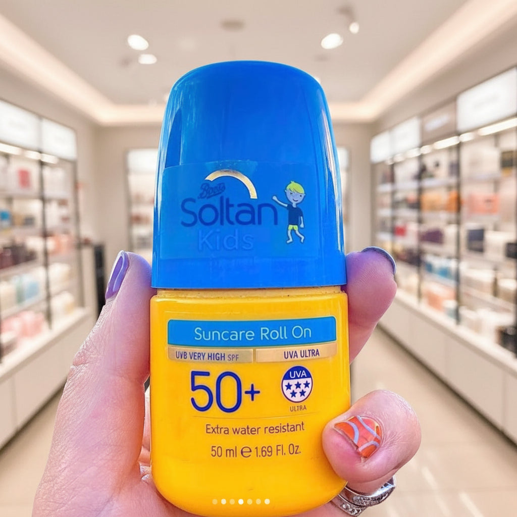 Soltan Kids sunscreen roll on held in front of a crowd at an event with a blue sky.